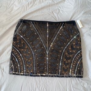 Embroidered acid wash jean skirt